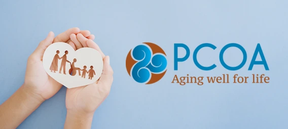 Hands holding a heart-shaped cutout of a family beside the PCOA logo.