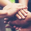 Solidarity unite people hands together community teamwork. Hands of spirit team working together outdoor. 